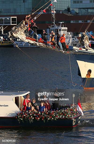 King Willem Alexander and Queen Maxima of the Netherlands are seen aboard the King's boat for the water pageant to celebrate the inauguration of King...