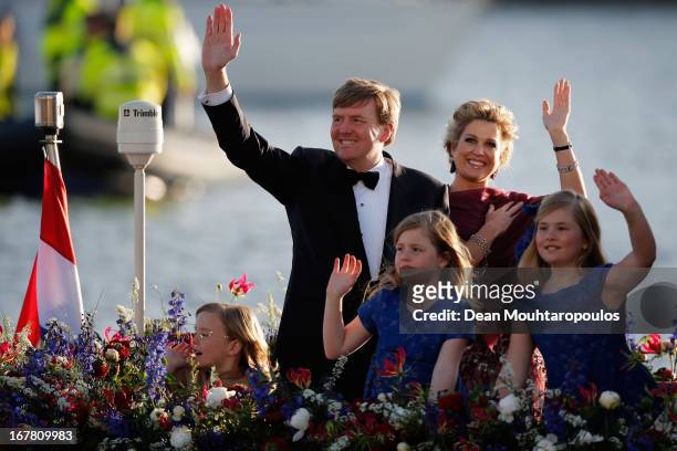 King Willem Alexander, Queen Maxima and their daughters Princess Catharina Amalia, Princess Ariane and Princess Alexia of the Netherlands wave to the...