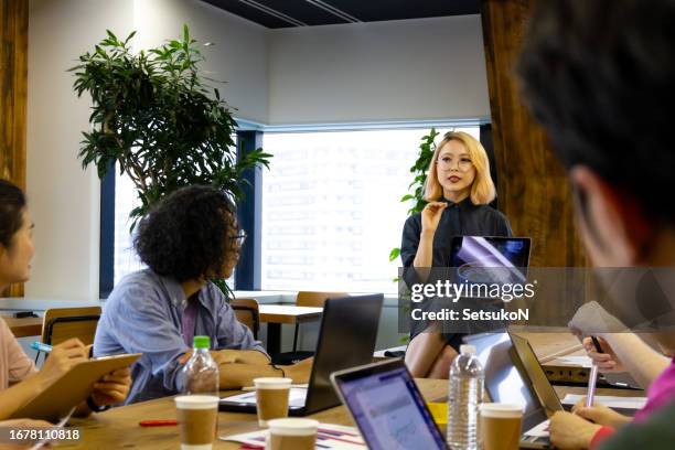 multiethnic business team working together - n tech stock pictures, royalty-free photos & images