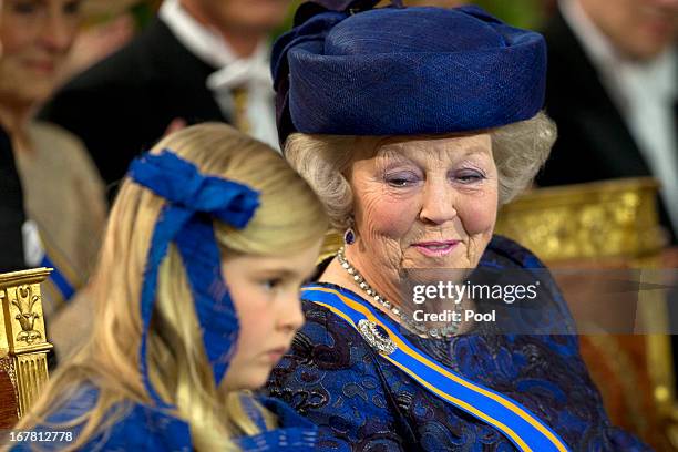 Princess Beatrix of the Netherlands sits with her grandaughter Princess Catharina-Amalia of the Netherlands during the inauguration ceremony of King...