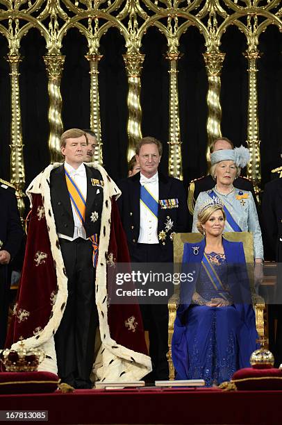 King Willem-Alexander of the Netherlands stands alongside HM Queen Maxima of the Netherlands during his swearing in and investiture ceremony in front...