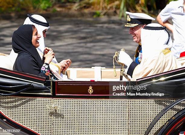 Sheikha Lubna Al-Qasimi, UAE Minister of Foreign Trade, photographs Prince Andrew, Duke of York using an iPhone as they travel in a horse drawn...