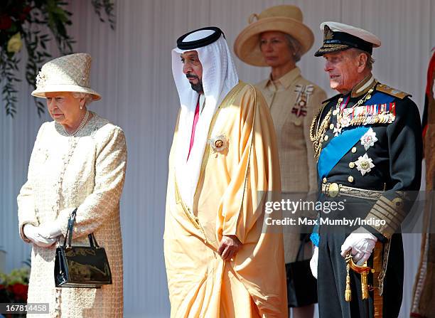 Queen Elizabeth II and Prince Philip, Duke of Edinburgh stand with UAE President, His Highness Sheikh Khalifa bin Zayed Al Nahyan during his...