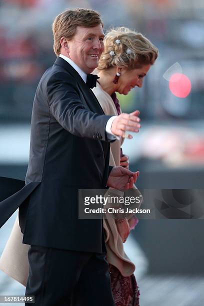 King Willem Alexander and Queen Maxima of The Netherlands arrive at the Muziekbouw following the water pageant after the abdication of Queen Beatrix...