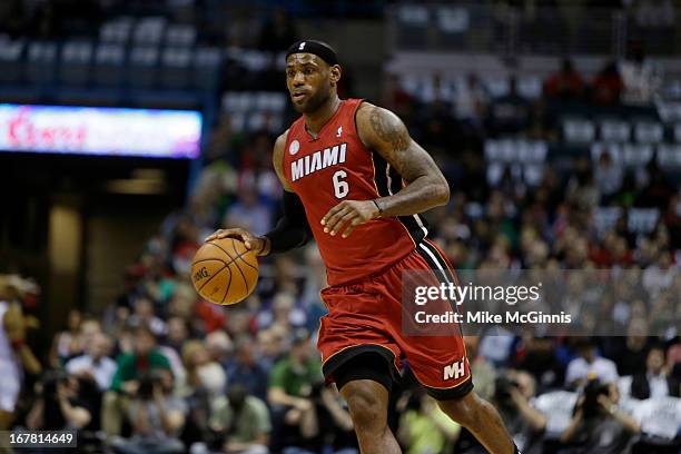 LeBron James of the Miami Heat dribbles up the court against the Milwaukee Bucks during Game Three of the Western Conference Quarterfinals of the...