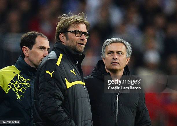 Head Coach Jurgen Klopp of Borussia Dortmund in discussion with head coach Jose Mourinho of Real Madrid during the UEFA Champions League Semi Final...
