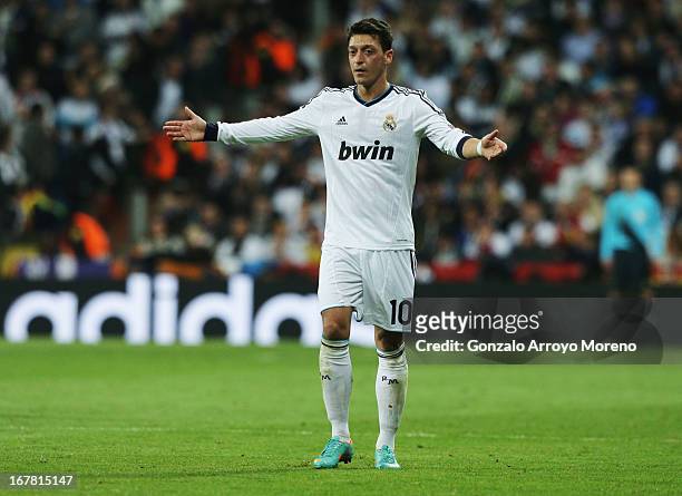 Mesut Ozil of Real Madrid appeals during the UEFA Champions League Semi Final Second Leg match between Real Madrid and Borussia Dortmund at Estadio...