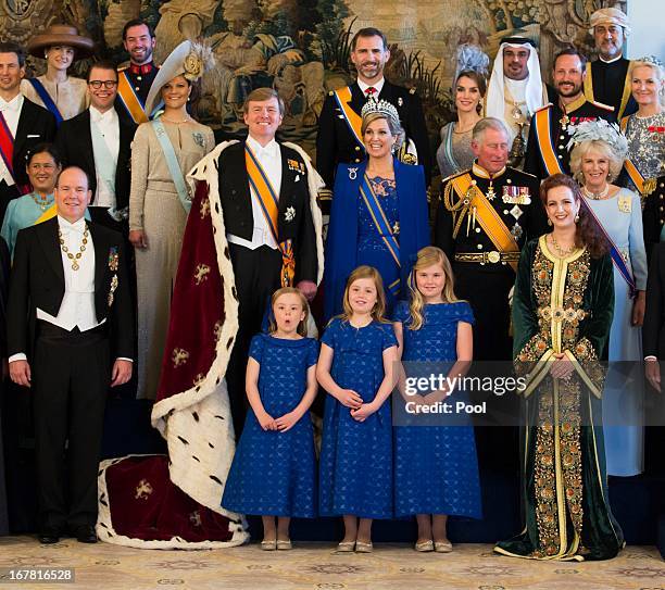 King Willem Alexander and Queen Maxima of the Netherlands pose with guests following their inauguration ceremony, at the Royal Palace on April 30,...