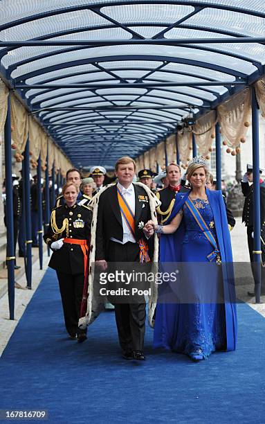 King Willem-Alexander of the Netherlands and HM Queen Maxima of the Netherlands leave following the inauguration ceremony at New Church on April 30,...