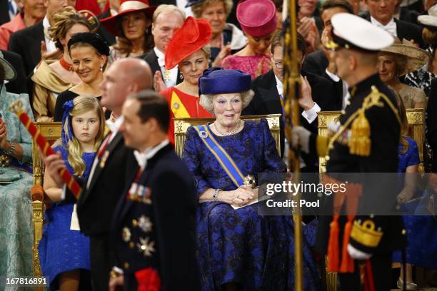 Princess Beatrix of the Netherlands sits together with her granddaughter Princess Catharina-Amalia of the Netherlands during the inaugaration...