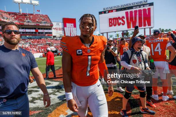 Chicago Bears quarterback Justin Fields leaves the field after a 27-17 loss to the Tampa Bay Buccaneers at Raymond James Stadium on Sept. 17 in...