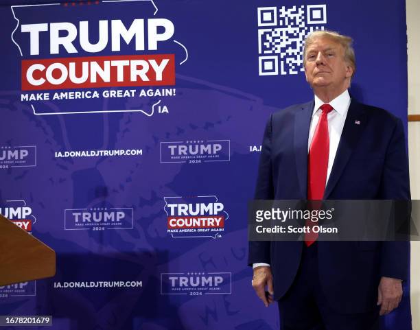 Republican presidential candidate and former U.S. President Donald Trump arrives for a "Commit To Caucus" rally at the Jackson County Fairgrounds on...