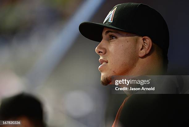 Pitcher Jose Fernandez of the Miami Marlin looks out of the dug out during a game against the New York Mets at Marlins Park on April 30, 2013 in...