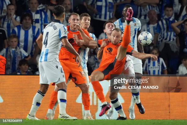 Inter Milan's Brazilian defender Carlos Augusto scissor-kicks the ball during the UEFA Champions League 1st round day 1 group D football match...