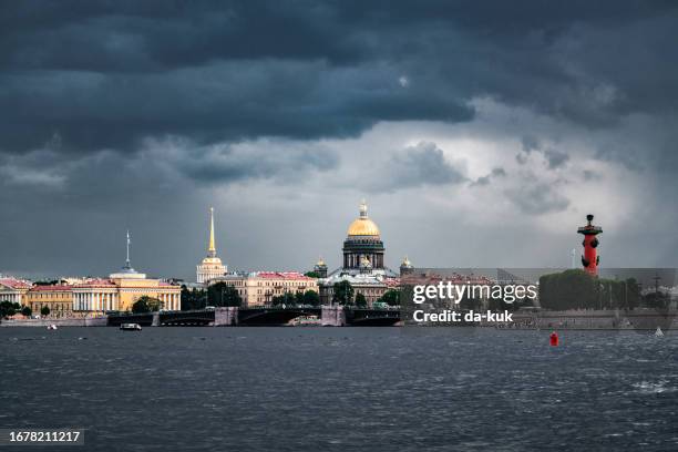 saint isaac's cathedral and spit of vasilievsky island seen from neva river. dramatic rainy clouds on the background. st. petersburg - russia architecture stock pictures, royalty-free photos & images
