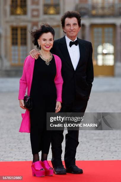 French former Culture minister Jack Lang and his wife Monique Buczynski arrive to attend a state banquet at the Palace of Versailles, west of Paris,...