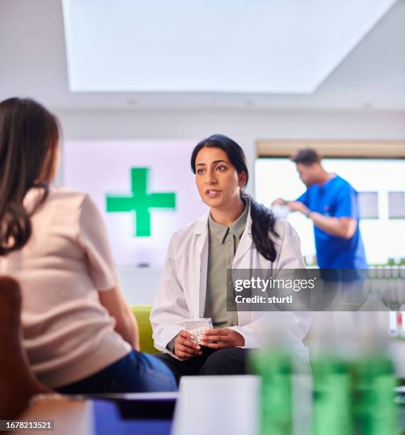 pharmacist consultation - pharmacy stock pictures, royalty-free photos & images