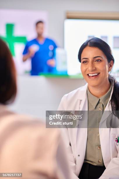 friendly pharmacy advice - patient communication stock pictures, royalty-free photos & images