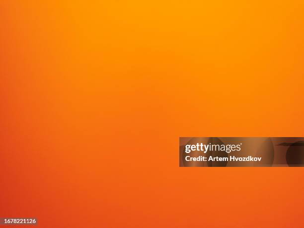 vibrant orange-yellow colored clear background - orange stock pictures, royalty-free photos & images