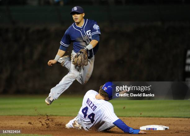 Everth Cabrera of the San Diego Padres forces out Anthony Rizzo of the Chicago Cubs during the seventh inning on April 30, 2013 at Wrigley Field in...