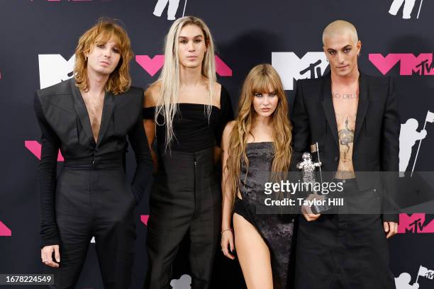 Thomas Raggi, Ethan Torchio, Victoria De Angelis, and Damiano David of Maneskin pose in the press room at the 2023 MTV Video Music Awards at...