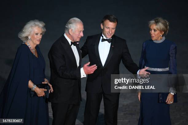 Britain's Queen Camilla, Britain's King Charles III, French President Emmanuel Macron and French president's wife Brigitte Macron arrive to attend a...