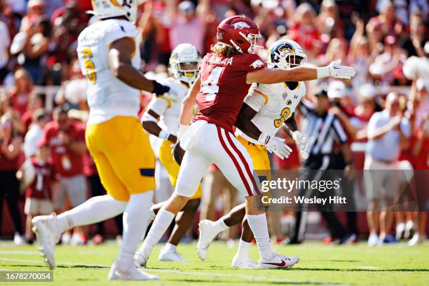 Isaac TeSlaa of the Arkansas Razorbacks signals first down during the game against the Kent State Golden Flashes at Donald W. Reynolds Razorback...