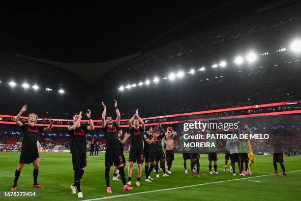 Salzburg players celebrate at the end of the UEFA Champions League 1st round day 1 group D football match between SL Benfica and RB Salzburg at the...