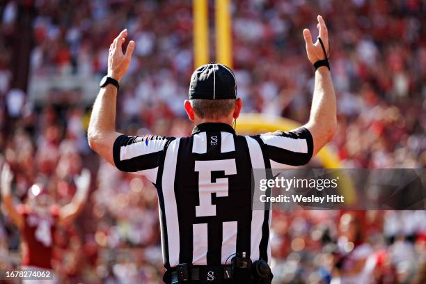 Official signals touchdown during a game between the Arkansas Razorbacks and the Kent State Golden Flashes at Donald W. Reynolds Razorback Stadium on...