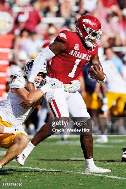 Jefferson of the Arkansas Razorbacks tis tackled by Nicholas Giacolone of the Kent State Golden Flashes at Donald W. Reynolds Razorback Stadium on...