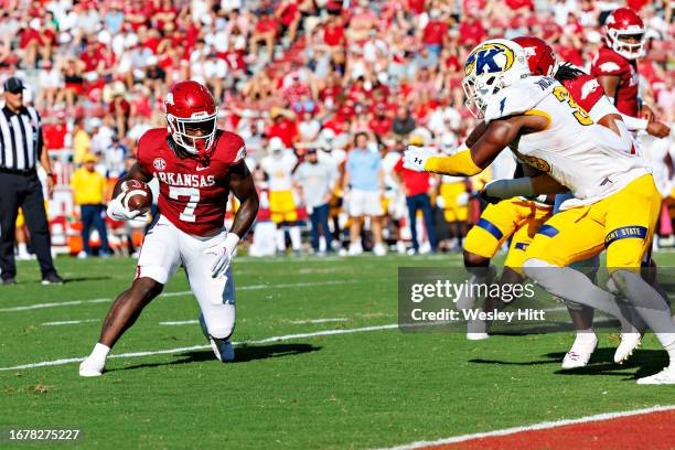 Rashod Dubinion of the Arkansas Razorbacks runs the ball during the game against the Kent State Golden Flashes at Donald W. Reynolds Razorback...