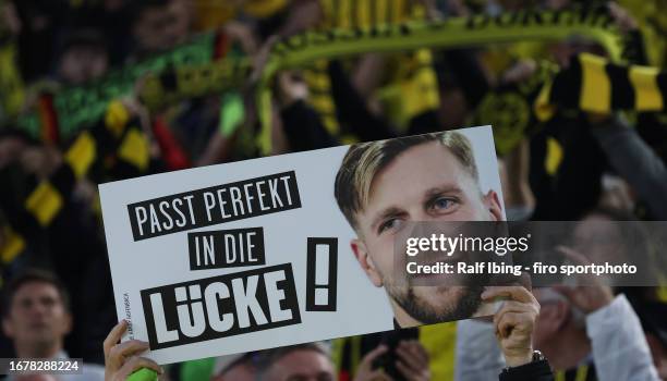 Fan of Borussia Dortmund holds up a placard to welcome new player Niclas Füllkrug ahead of the Bundesliga match between Borussia Dortmund and 1. FC...