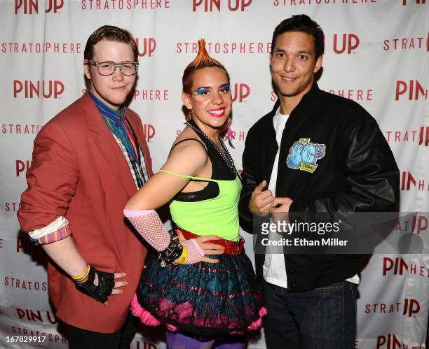 Entertainers Kolton Rostron, Kiersten Huang and Alex Lum from "The 80's Show" arrive at the premiere of the show "Pin Up" at the Stratosphere Casino...