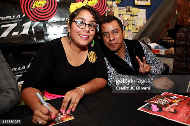 La Marisoul and Jose Carlos of the band La Santa Cecilia sign copies of their new album "Treintas Dias" at Amoeba Music on April 30, 2013 in...