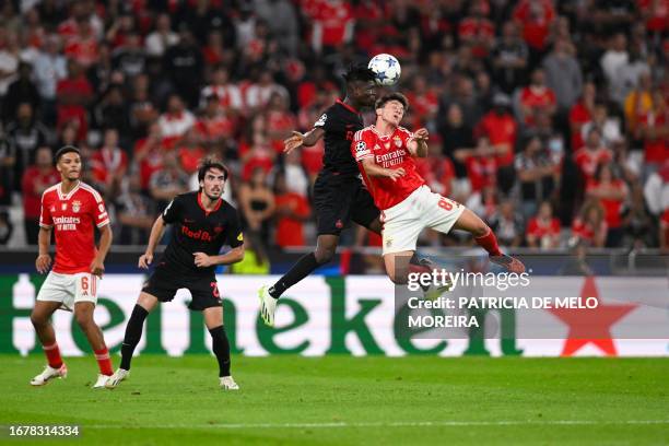 Benfica's Norwegian midfielder Fredrik Aursnes heads the ball during the UEFA Champions League 1st round day 1 group D football match between SL...