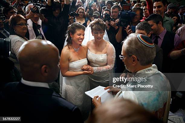 Anna and Fran Simon, both of Denver, Colorado, are the first same-sex couple to be issued a Civil Union license at a midnight ceremony in the Denver...