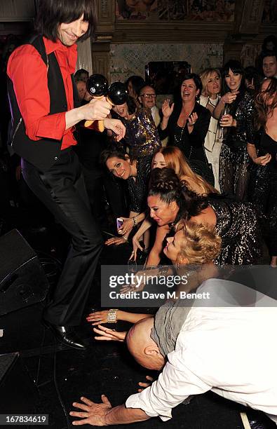 Bobby Gillespie of Primal Scream performs as guests including Annabelle Neilson, Rosemary Ferguson, Mary Charteris, Fran Cutler and Kate Moss look on...