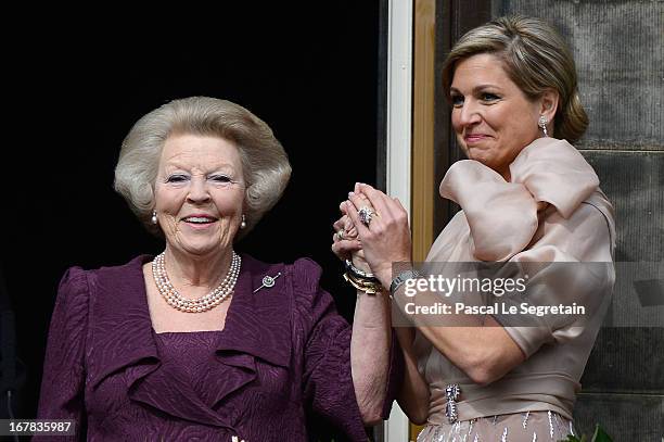 Queen Beatrix of the Netherlands and Queen Maxima appear on the balcony of the Royal Palace to greet the public after her abdication and ahead of the...