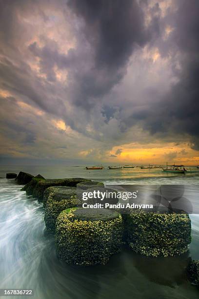 dark cloud hang over - sanur stock pictures, royalty-free photos & images