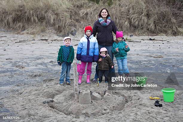 mom and four kids on the beach - lincoln city oregon stock pictures, royalty-free photos & images