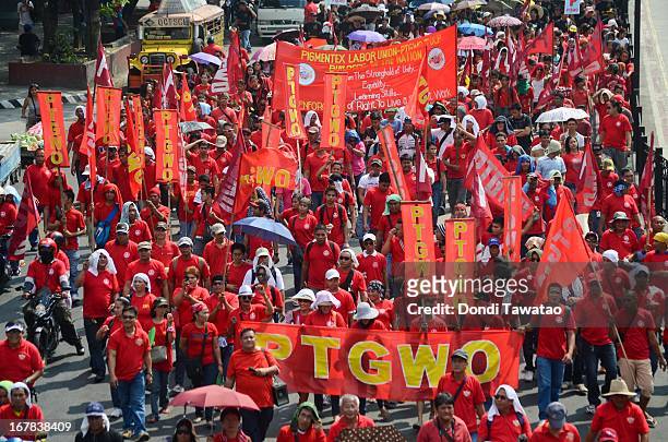 Labor groups and trade unions march near the presidential palace on May 1, 2013 in Manila, Philippines. The Philippines workers unions gather in the...