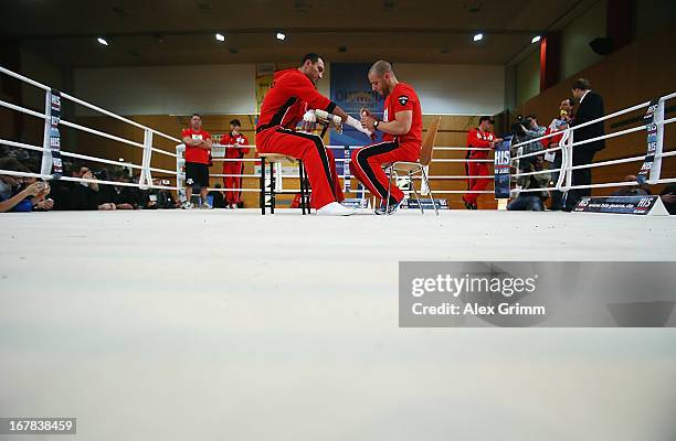 World Champion Wladimir Klitschko of Ukraine gets his hands bandaged during the official training session ahead of his IBF, WBA, WBO and IBO World...