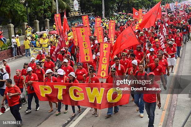 Labor groups and trade unions march near the presidential palace on May 1, 2013 in Manila, Philippines. The Philippines workers unions gather in the...