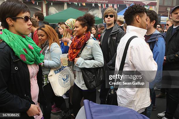 Visitors walk through crowded streets at the MyFest street food and music fest in immigrant-heavy Kreuzberg district on May Day on May 1, 2013 in...