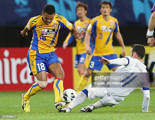 Japan's Vegalta Sendai forward Wilson competes for the ball against China's Jiangsu Sainty forward Hamdi Salihi during their AFC Champions League...
