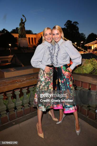 Nina Meise and her twin sister Julia Meise during the 188th Oktoberfest at Käferzelt on September 20, 2023 in Munich, Germany.