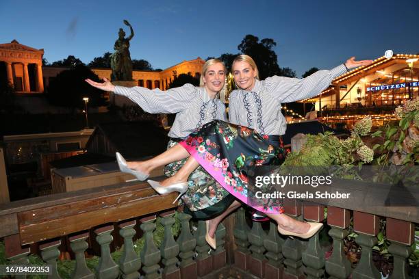 Nina Meise and her twin sister Julia Meise during the 188th Oktoberfest at Käferzelt on September 20, 2023 in Munich, Germany.