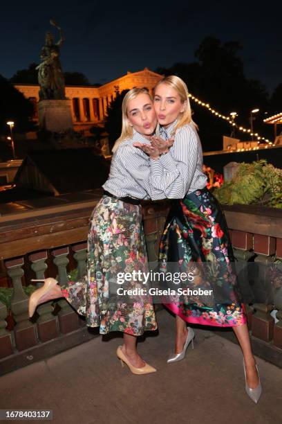 Nina Meise and her twin sister Julia Meise during the 188th Oktoberfest at Käferzelt on September 20, 2023 in Munich, Germany.