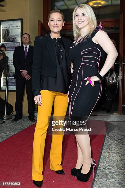 German singer Helene Fischer and Swiss singer Beatrice Egli attend the premiere of the documentary 'Allein im Licht' at the Babylon cinema on April...