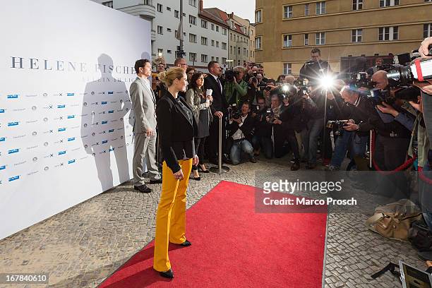 German singer Helene Fischer poses for photographers prior to the premiere of the documentary 'Allein im Licht' at the Babylon cinema on April 30,...